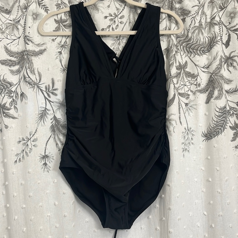 Woman’s black medium bathing suit.  Never worn